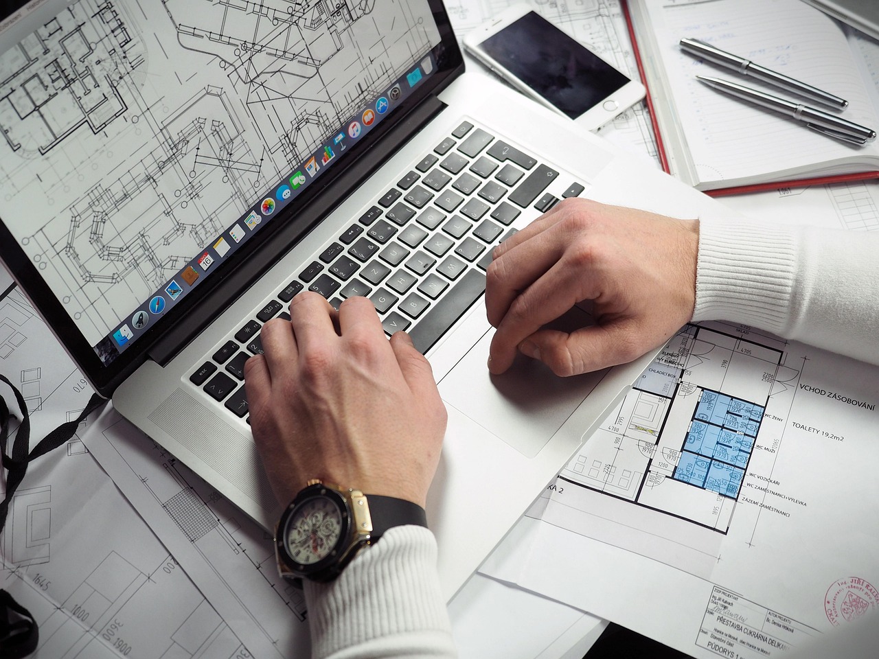 Blueprints, entrepreneur, hands — Fire Watch Services Near Me Offering Immediate Service and Certified Personnel
