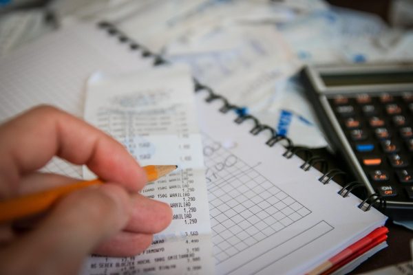 Money, bills, calculator — The Andrew Hillman Method for Enhancing Business Operations