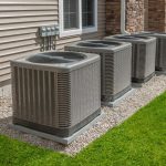 Multiple air conditioning units installed outside a house